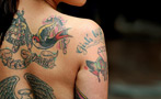 Sandra Bullock's Husband Supposedly Cheated on Her With a Tattoo Model. Is That a Real Job?