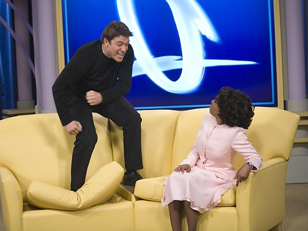 "Tom" jumps on "Oprah's" couch in Scary Movie 4.
