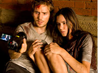 Michael Stahl-David (left) and Odette Yustman are terrorized by a monstrous creature in Cloverfield
Click image to expand.