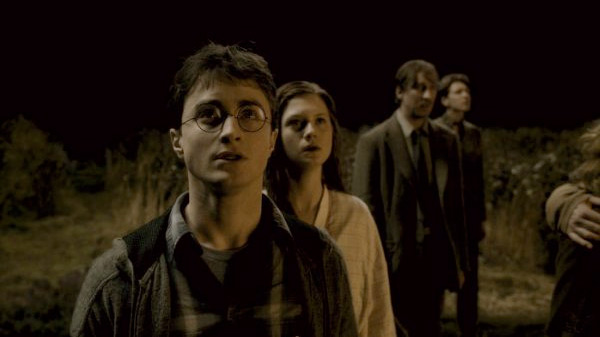 David Thewlis, Daniel Radcliffe, Bonnie Wright, and Oliver Phelps in Harry Potter and the Half-Blood Prince.