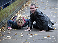 Billie Piper and Christopher Eccleston hit the ground in Dr. Who
Click image to expand.