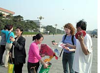 Emma surrounded by kite-sellers