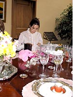 Cristina opening presents at her bridal shower