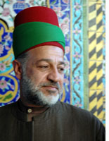 A shrine guide at Karbala
Click image to expand.
