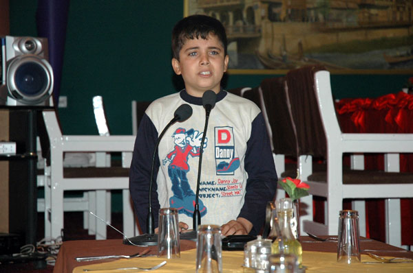 Hassan singing at breakfast.