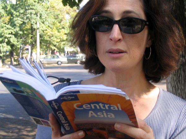 Sharon consults the Lonely Planet guide.