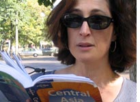 Sharon consults the Lonely Planet guide. Click image to expand.