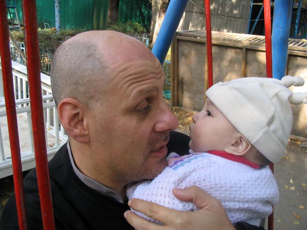 Father and daughter eye each other.