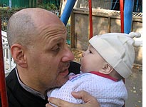 Father and daughter eye each other. Click image to expand.