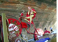 This cyclist rides his giant bike through the entire Tour, all in the name of cheese