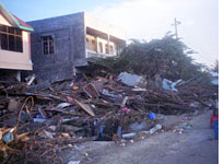 Shops and homes are reduced to rubble and debris