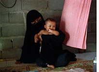Paridah with her youngest child, Osama. Click image to expand.