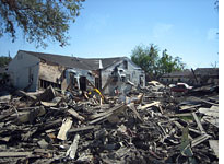 Some houses remained intact because they’d floated away. Click image to expand.