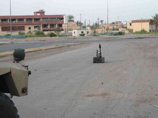 Robot on way to detonate IED.