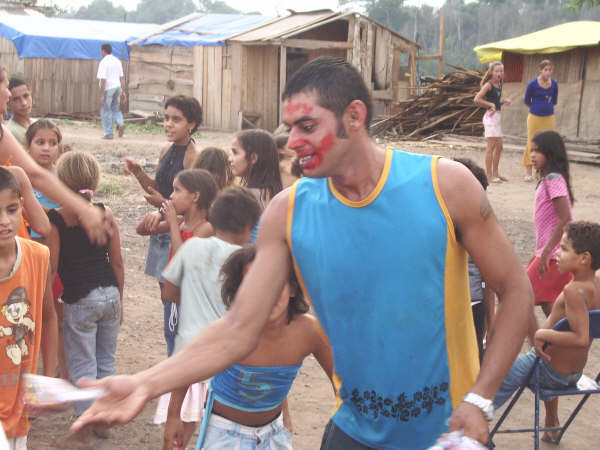 On Children's Day, each household in the encampment baked a small piece of what would be a giant cake; the main event was a clown with a face made up in lipstick.
