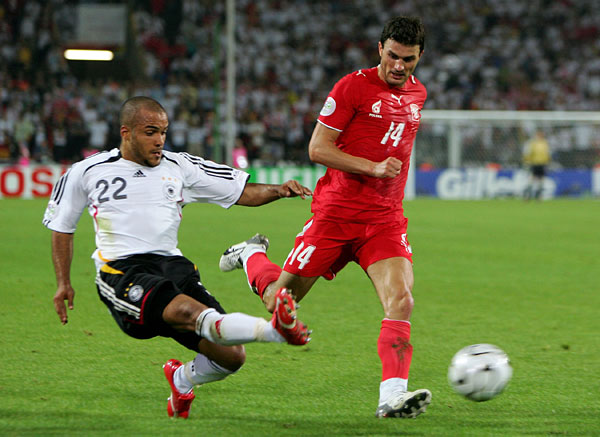 David Odonkor of Germany and Michal Zewlakow of Poland.