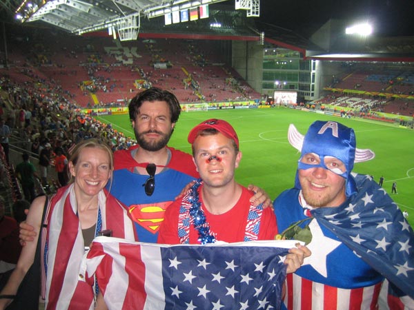 Superman, Captain America, and friends salute the USA.