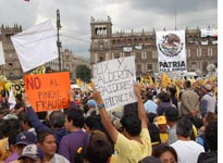 As many as 250,000 supporters of Andrés Manuel López Obrador gathered in Mexico City's central square July 8, some carrying signs with angry messages like "No to F____g Fraud" and "Fox and Calderón: Traitors to Democracy" 
Click image to expand