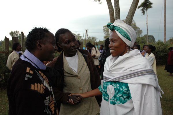 Pressing the flesh; Ringera (right) on the campaign trail.