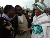 Pressing the flesh; Ringera (right) on the campaign trail. 
Click image to expand.