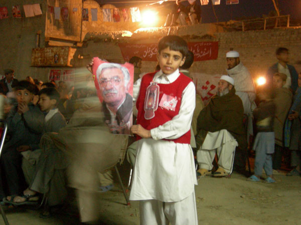 A young ANP supporter with an Asfandyar Wali Khan poster.