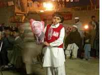 A young ANP supporter with an Asfandyar Wali Khan poster 
Click image to expand.