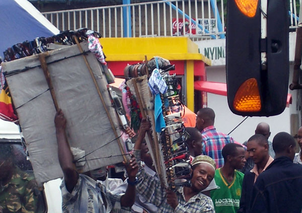 Young men sell a variety of products on the streets of Arusha.