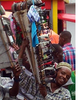 Young men sell a variety of products on the streets of Arusha. Click image to expand.