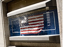 A window broken by protesters.