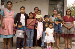 Family members of men captured by U.S. immigration authorities during a raid on the Agriprocessors Inc. meatpacking plant in Postville, Iowa in May 2008. Hilda Gil, wife of Freddy Granados, stands second from the left. Click image to expand.