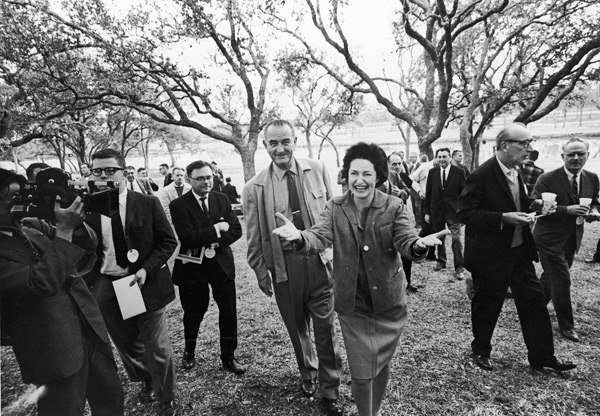 Lady Bird Johnson greets the press.