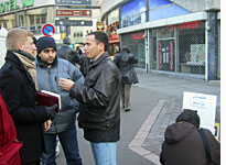 A Jehovah's Witness talks to local residents in St. Denis