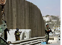 Israeli security barrier. Click image to expand.