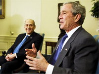 Ehud Olmert with George W. Bush. Click image to expand.