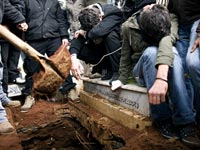 A funeral for one of the demonstrators killed Sunday. Click image to expand.