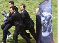 Protester at the torch ceremony. Click image to expand.
