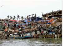 Houses destroyed by cyclone Nargis. Click image to expand.