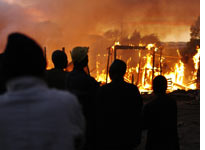 Shacks burn in the outskirts of Johannesburg, South Africa. Click image to expand
