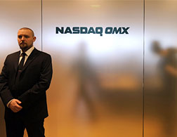 A security guard stands in front of the stock market room in Reykjavík. Click image to expand.