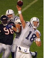 Quarterback Peyton Manning throws a pass. Click image to expand.