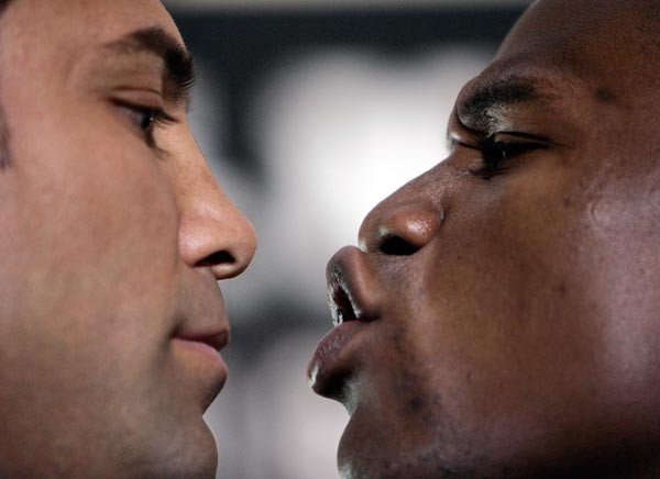 Oscar de la Hoya and Floyd Mayweather face off during a press conference.