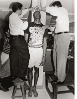A basketball player getting measured in the Philippines. Click image to expand.