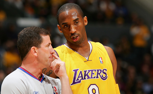 Kobe Bryant consults with NBA referee Tim Donaghy.
