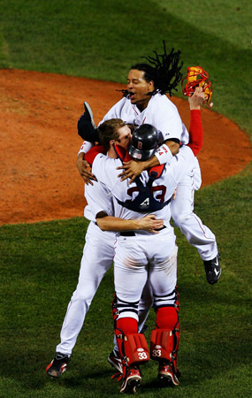 Manny Ramirez, Jonathan Papelbon, and Jason Varitek of the Red Sox celebrate defeating the Cleveland Indians.