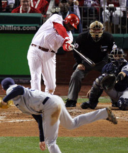 Ryan Howard of the Philadelphia Phillies hits a three-run home run. Click image to expand.