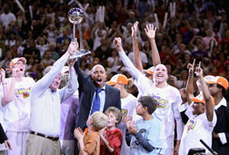 Members of the Phoenix Mercury celebrate with the WNBA trophy. Click image to expand.