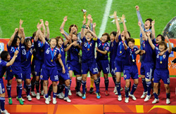 Japan's Womens soccer team celebrate their win.