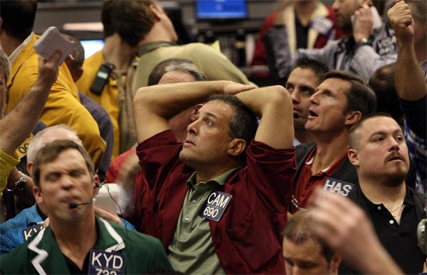 Traders watch prices at the Chicago Mercantile.