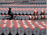 Barrels filled with fuel in Jakarta. Click image to expand.