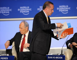 Turkish Prime Minister Recep Tayyip Erdogan leaves a debate. Click image to expand.